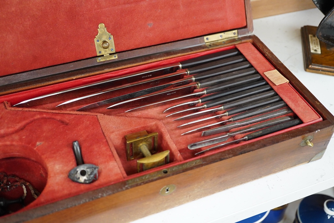 A 19th century surgeon’s set by Collin & Cil., Paris, in a fitted mahogany case, comprising of steel surgeons instruments; knives, scalpels, scoops, tourniquet, saws, rasps, some instruments stamped with maker’s name, wi